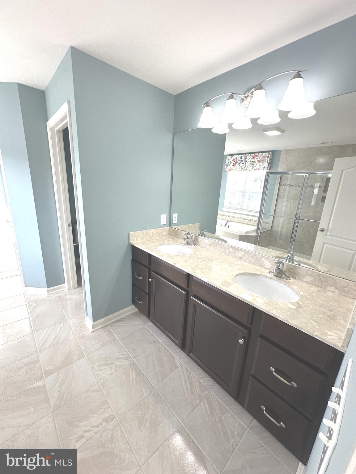 211 Arrowood Drive Smyrna, DE 19977 - Photo 16 of 22 a bathroom with a sink double vanity and a mirror
