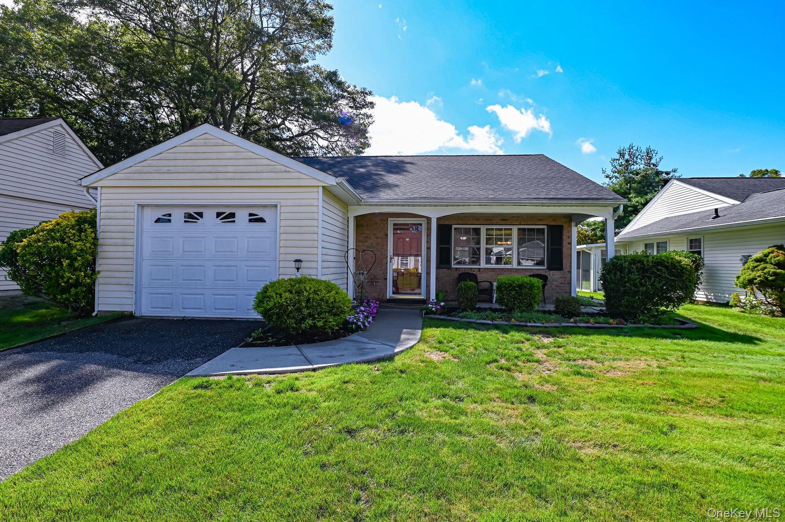 324 Brownfield Drive Ridge, NY 11961 - Photo 1 of 1 a view of a house with garden