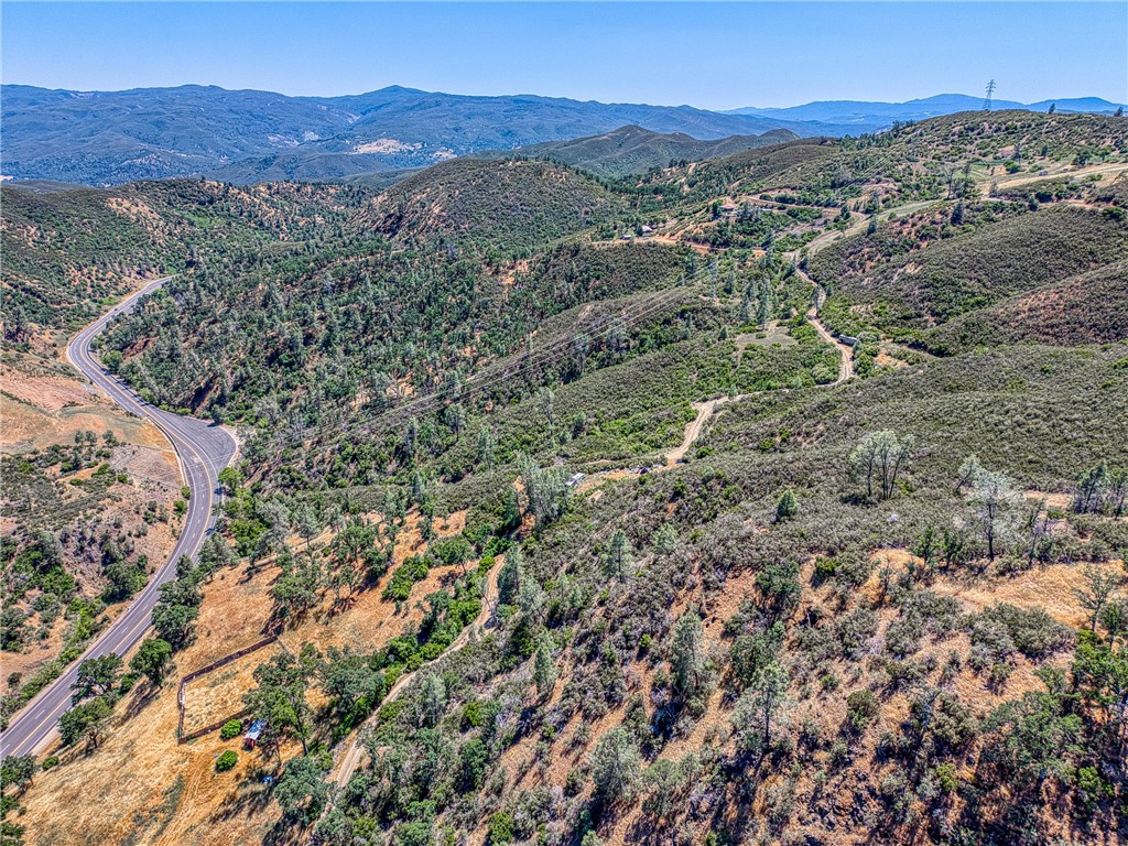 104 Mule Skinner Road Clearlake Oaks, CA 95423 - Photo 15 of 25 a view of a lush green hillside and a mountain