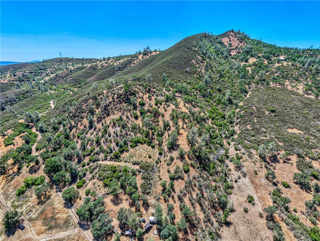 104 Mule Skinner Road Clearlake Oaks, CA 95423 - Photo 21 of 25 a view of a large mountain with a lush green field