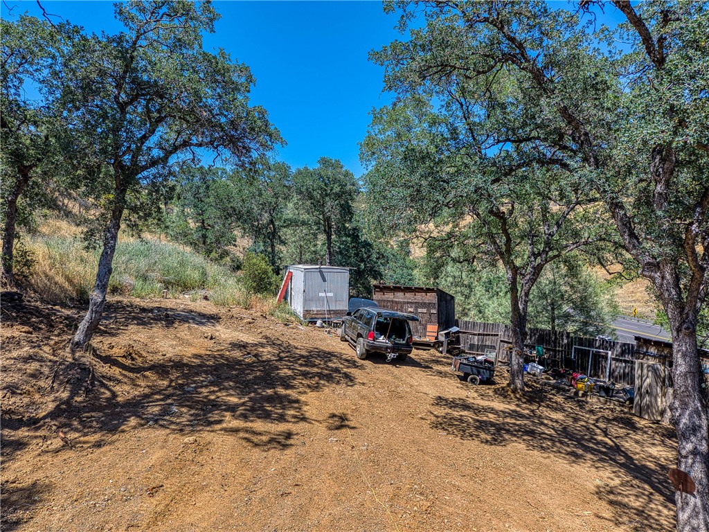 104 Mule Skinner Road Clearlake Oaks, CA 95423 - Photo 9 of 25 a view of a road with trees
