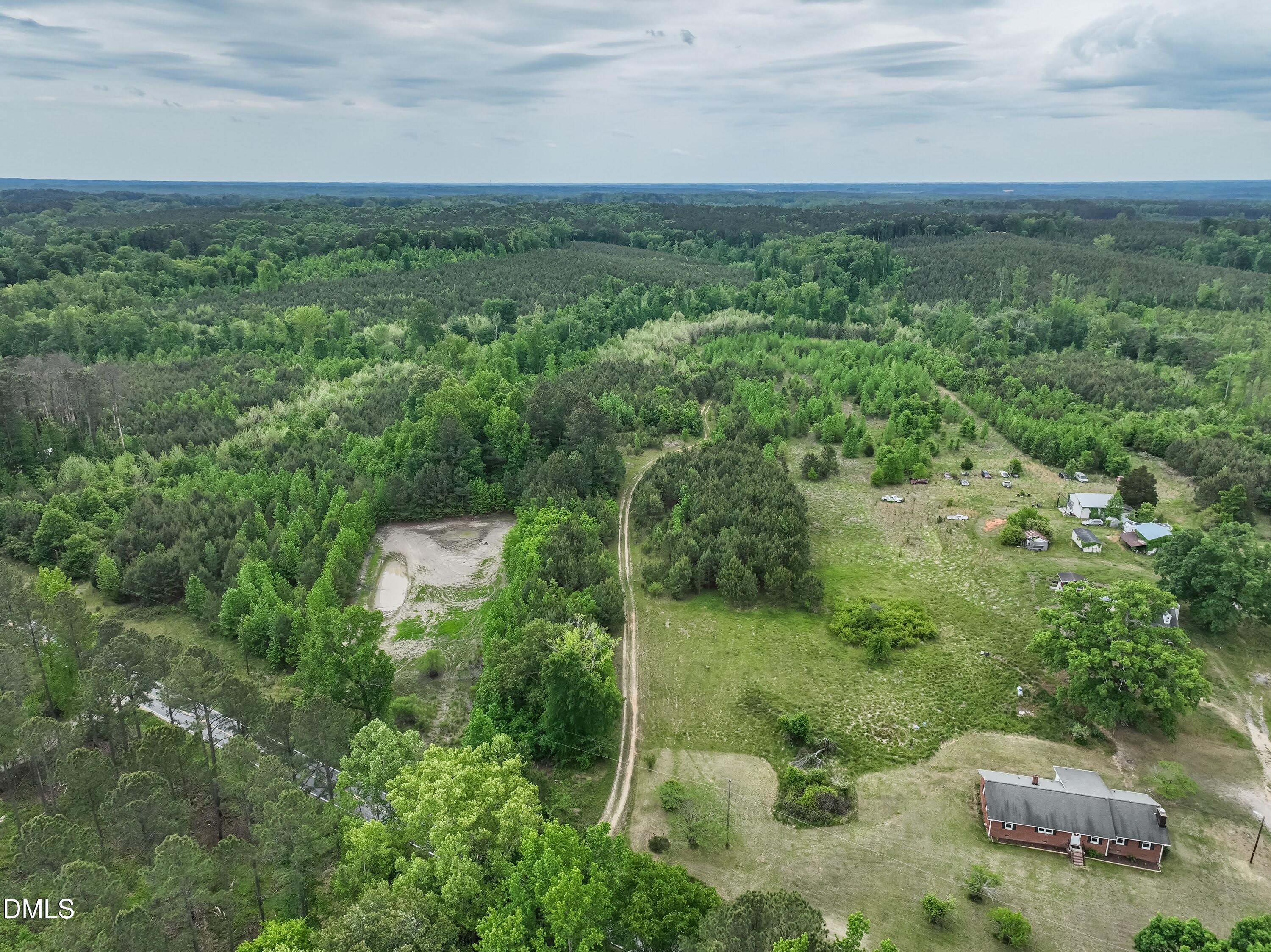 641 Rocky Ford Road Louisburg, NC 27549 - Photo 1 of 38 a view of a city with lush green forest