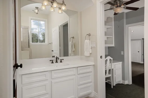 a bathroom with a sink double vanity and a mirror