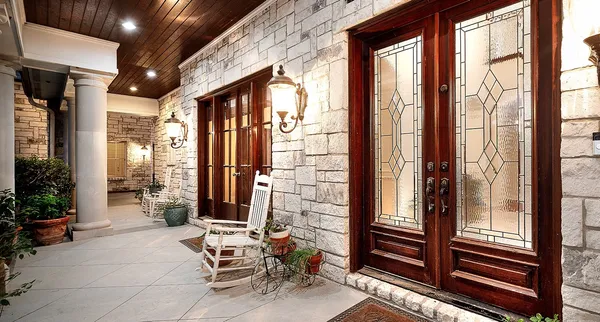 a view of balcony with wooden floor and outdoor seating