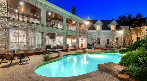 a view of a swimming pool with a patio