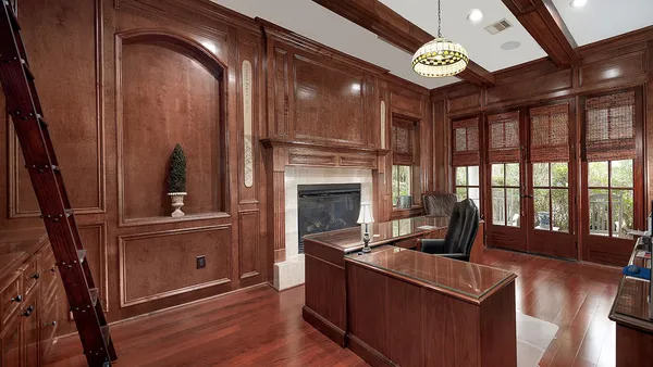 a living room with furniture fireplace and flat screen tv