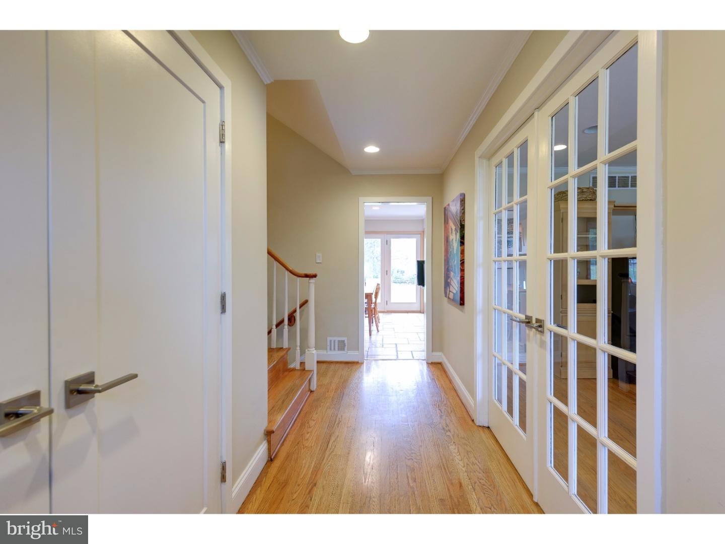 1935 County Line Road Villanova, PA 19085 - Photo 5 of 25 a view of a hallway with wooden floor and staircase