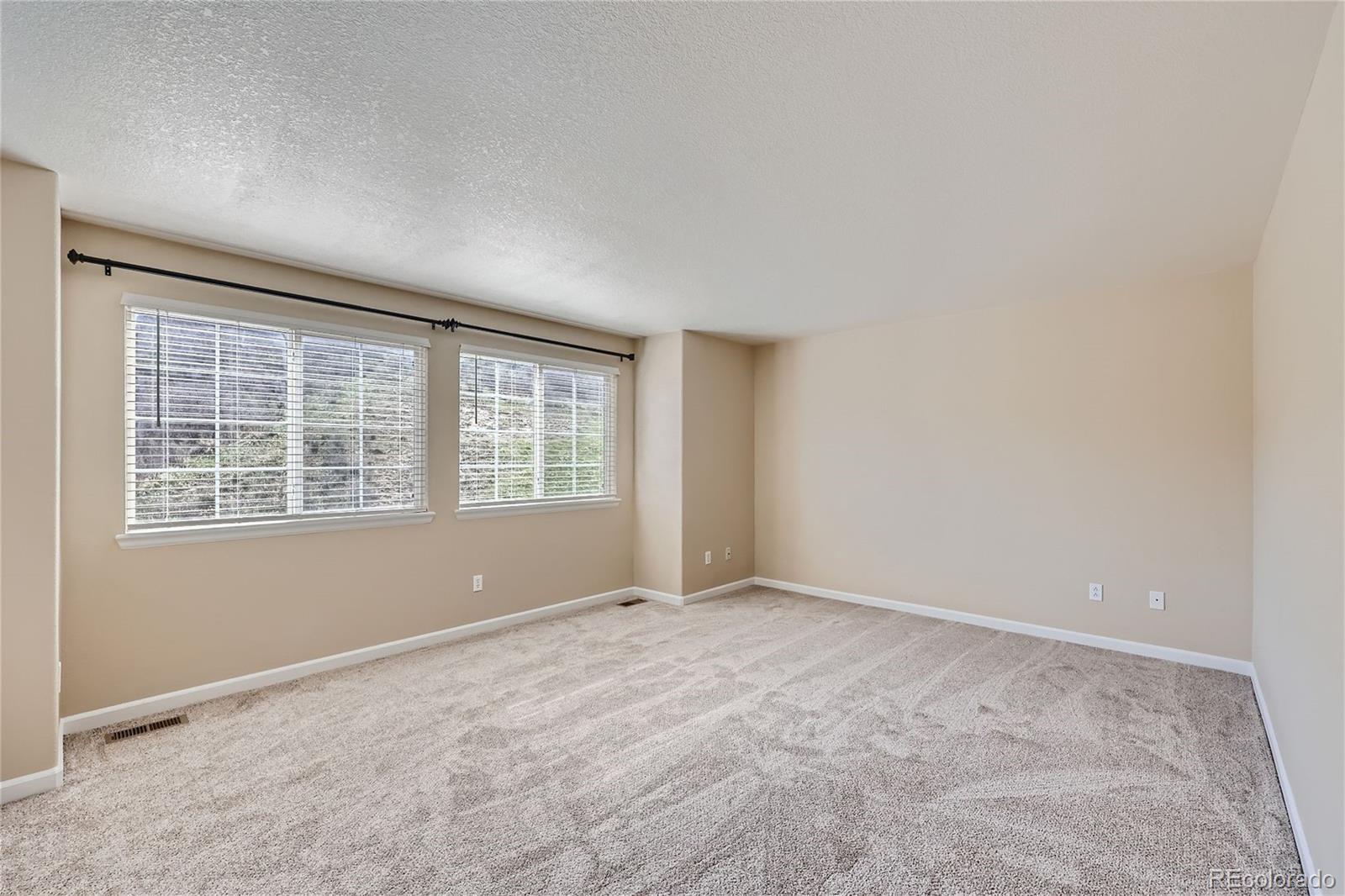 1515 Live Oak Road Castle Rock, CO 80104 - Photo 11 of 26 a view of an empty room with a window