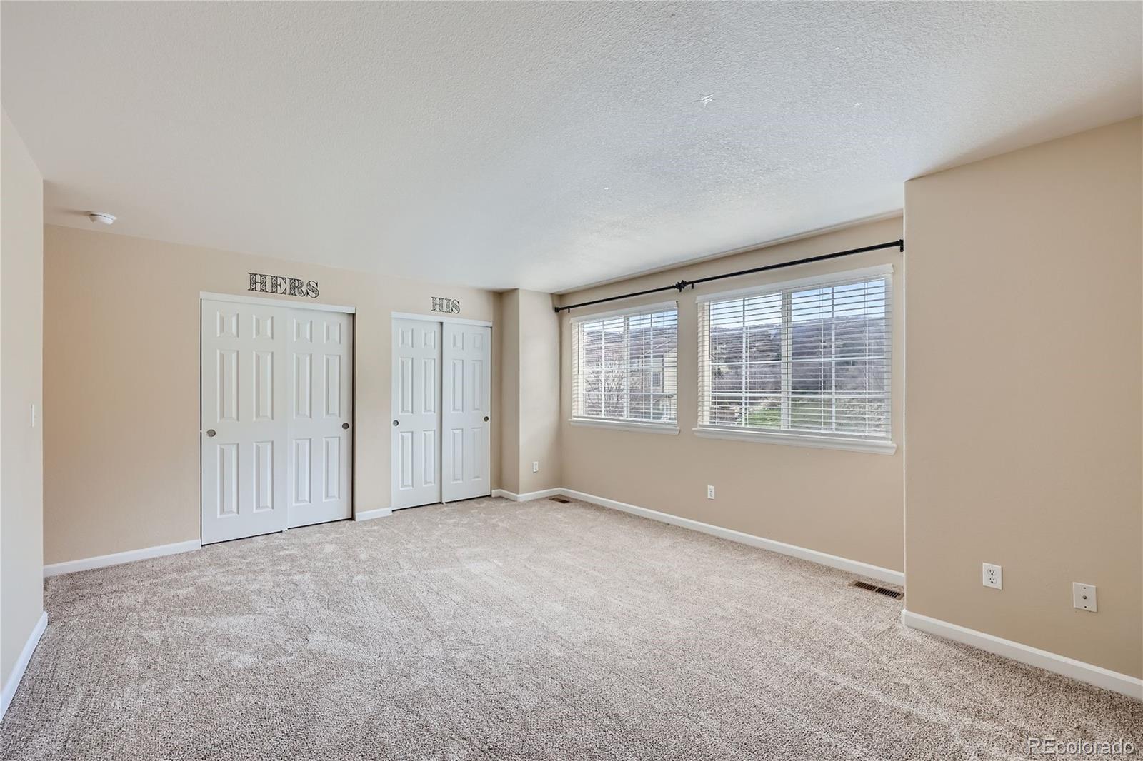 1515 Live Oak Road Castle Rock, CO 80104 - Photo 13 of 26 an empty room with windows
