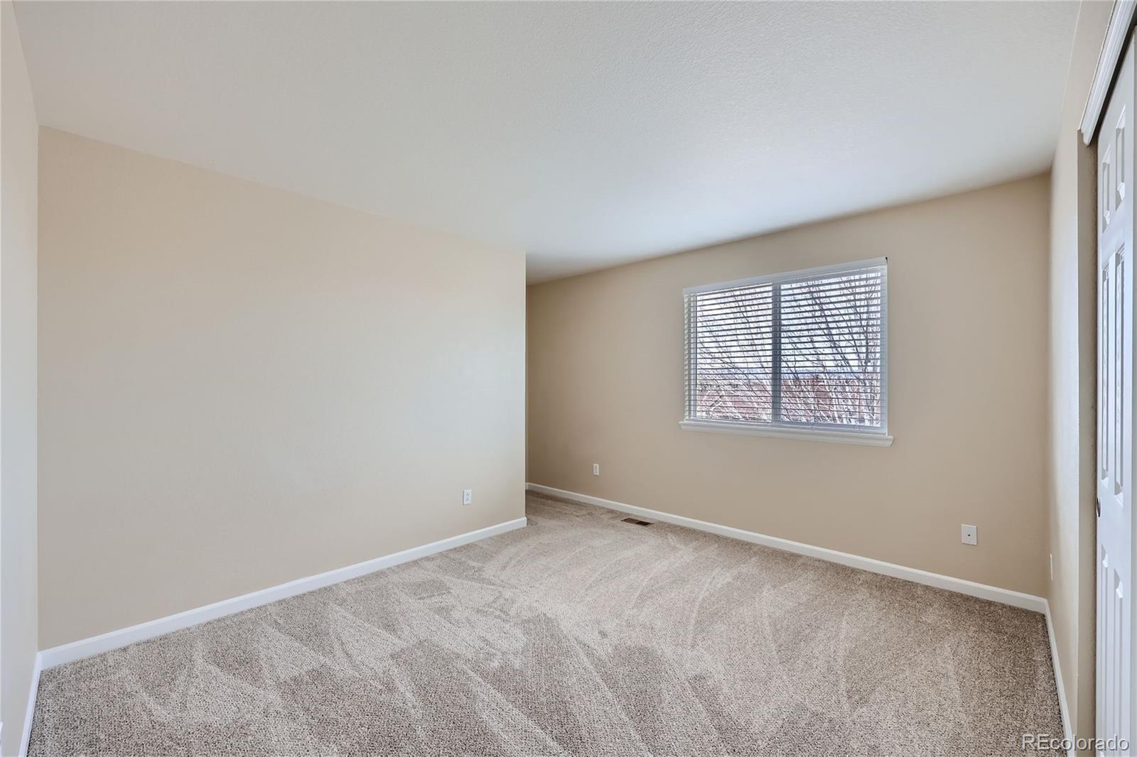 1515 Live Oak Road Castle Rock, CO 80104 - Photo 16 of 26 an empty room with windows