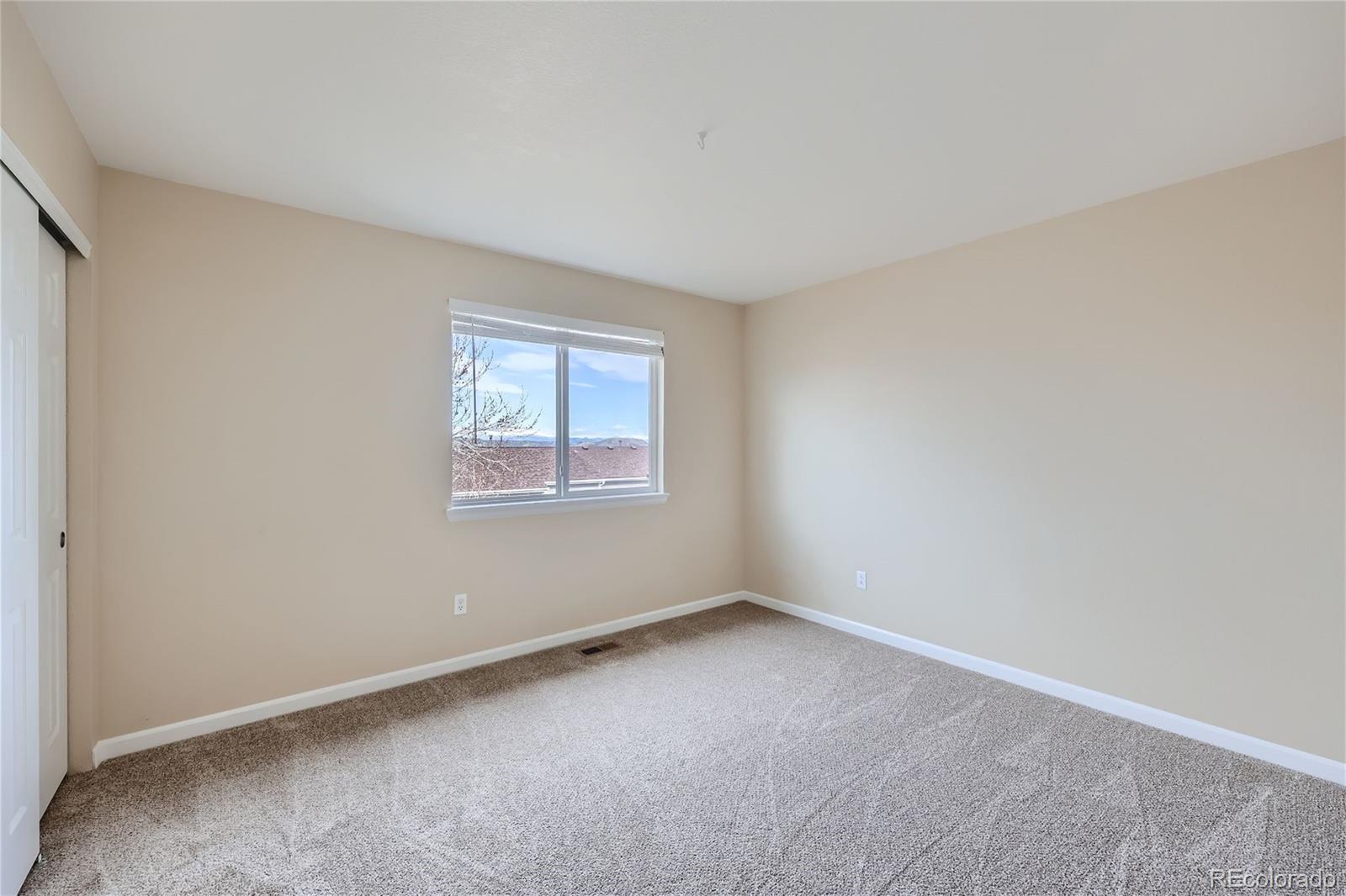 1515 Live Oak Road Castle Rock, CO 80104 - Photo 17 of 26 an empty room with a window