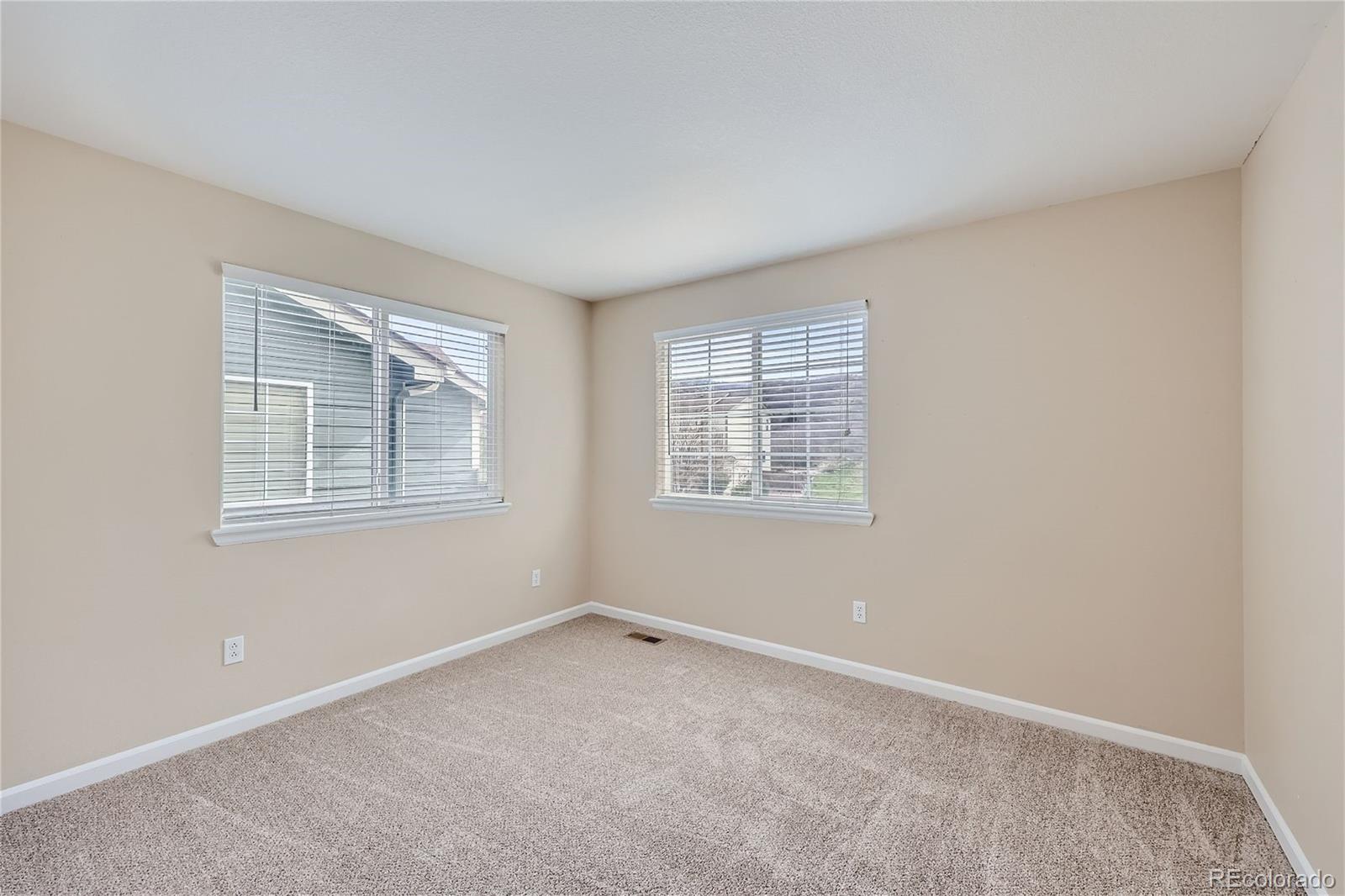 1515 Live Oak Road Castle Rock, CO 80104 - Photo 19 of 26 an empty room with windows