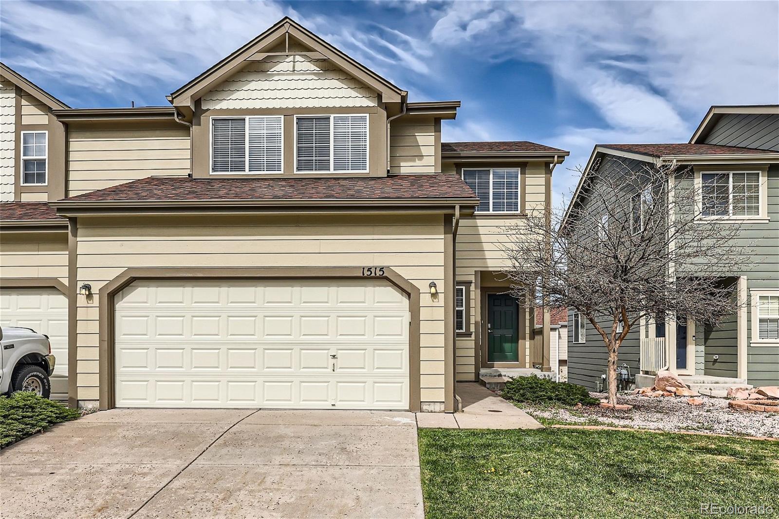 1515 Live Oak Road Castle Rock, CO 80104 - Photo 2 of 26 a front view of a house with garden