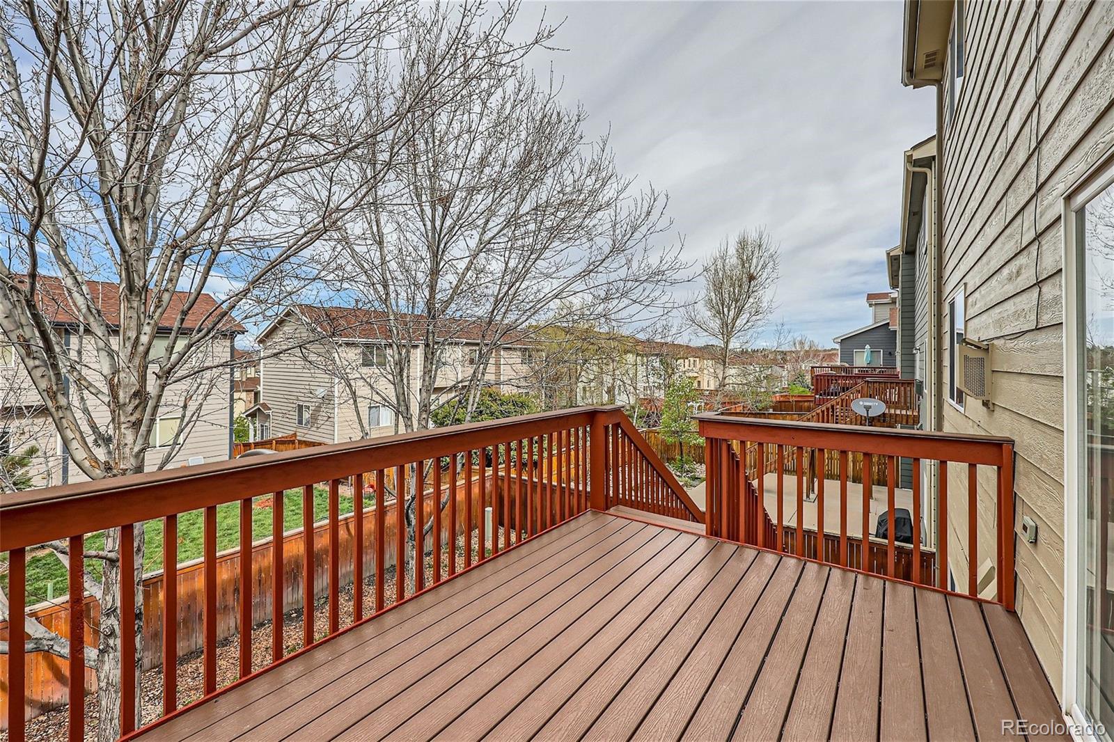 1515 Live Oak Road Castle Rock, CO 80104 - Photo 23 of 26 a view of balcony with wooden floor and fence