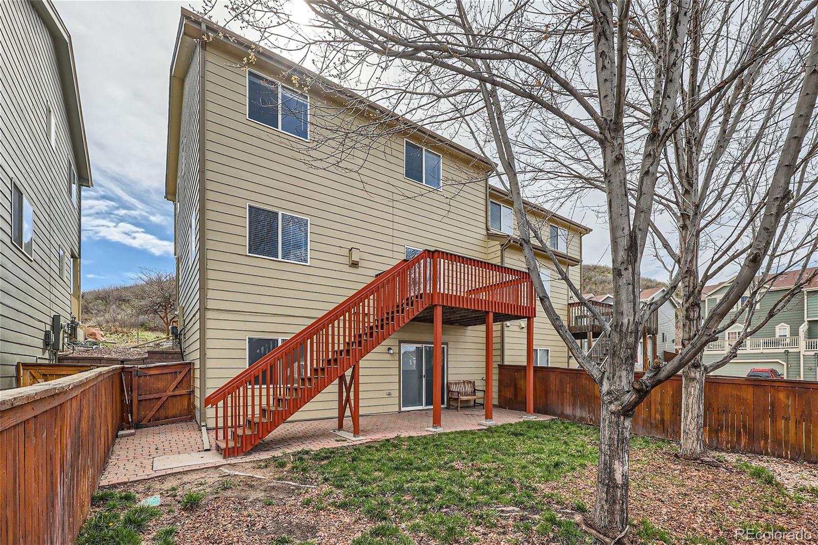 1515 Live Oak Road Castle Rock, CO 80104 - Photo 25 of 26 a view of a house with a yard