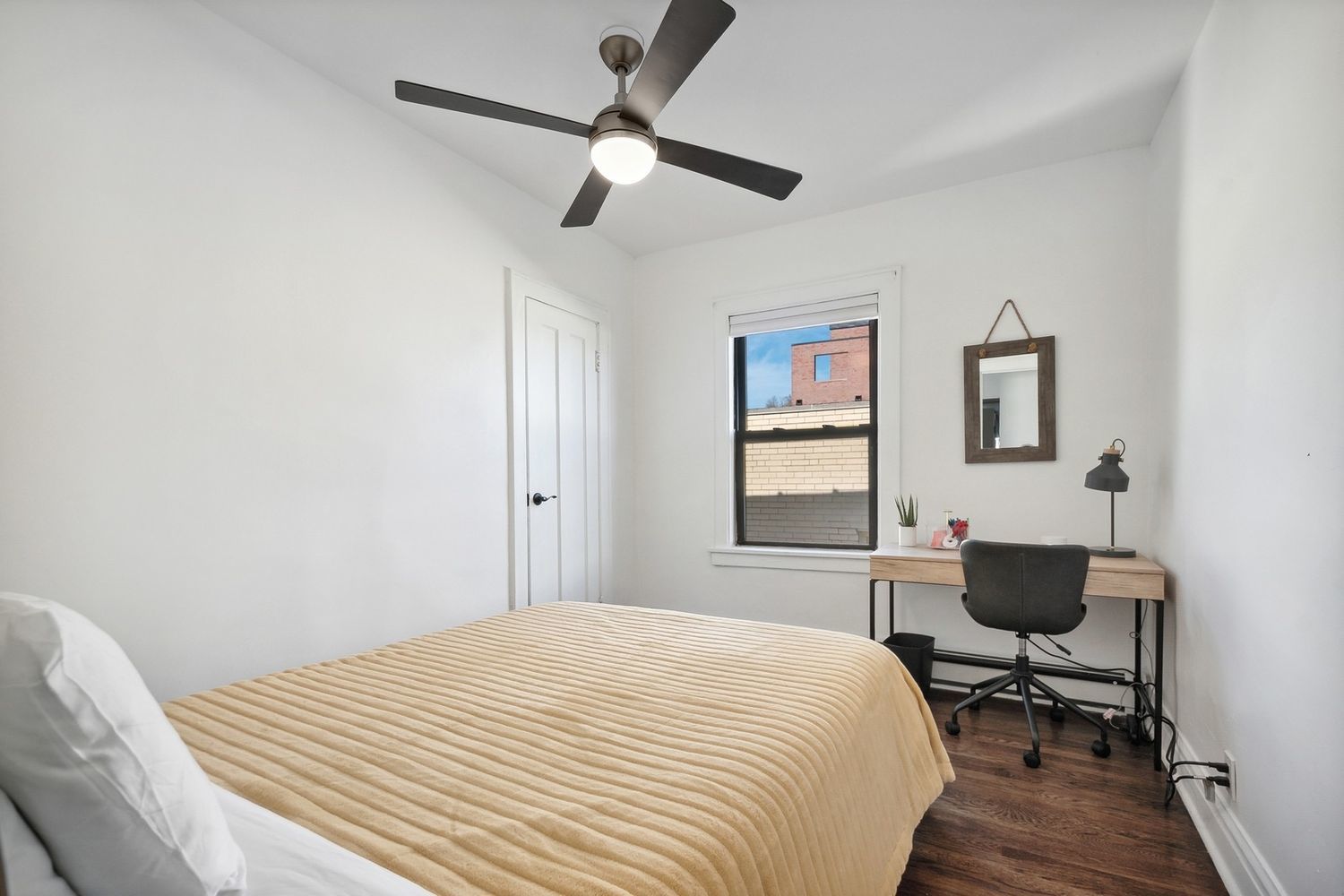 5426 North Western Avenue Chicago, IL 60625 - Photo 16 of 22 a bedroom with a bed and a chandelier