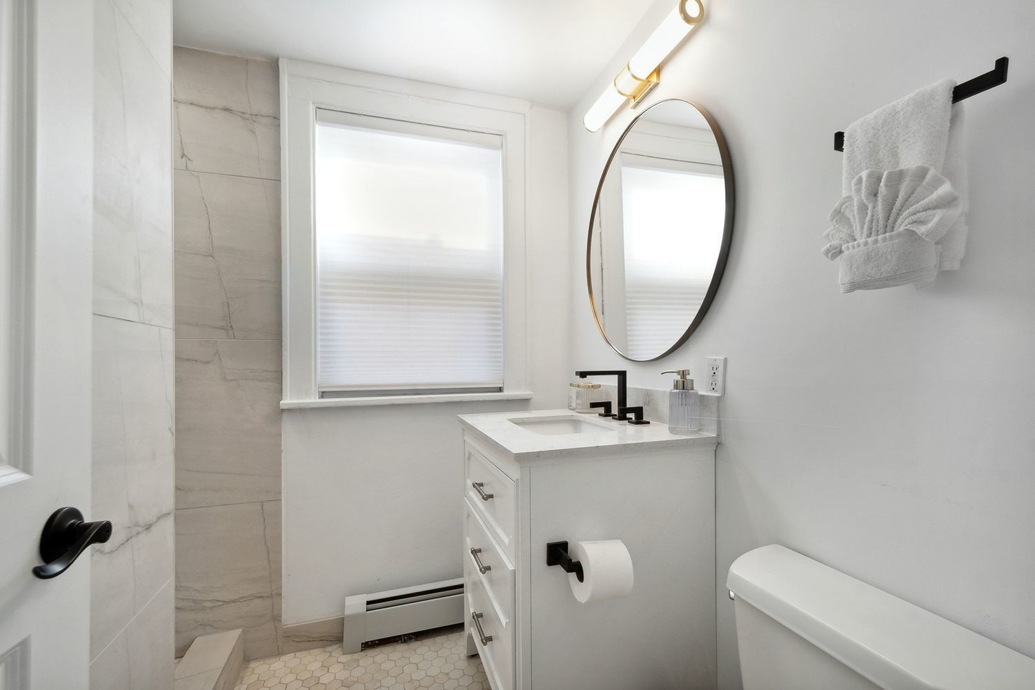 5426 North Western Avenue Chicago, IL 60625 - Photo 18 of 22 a bathroom with a sink and a mirror