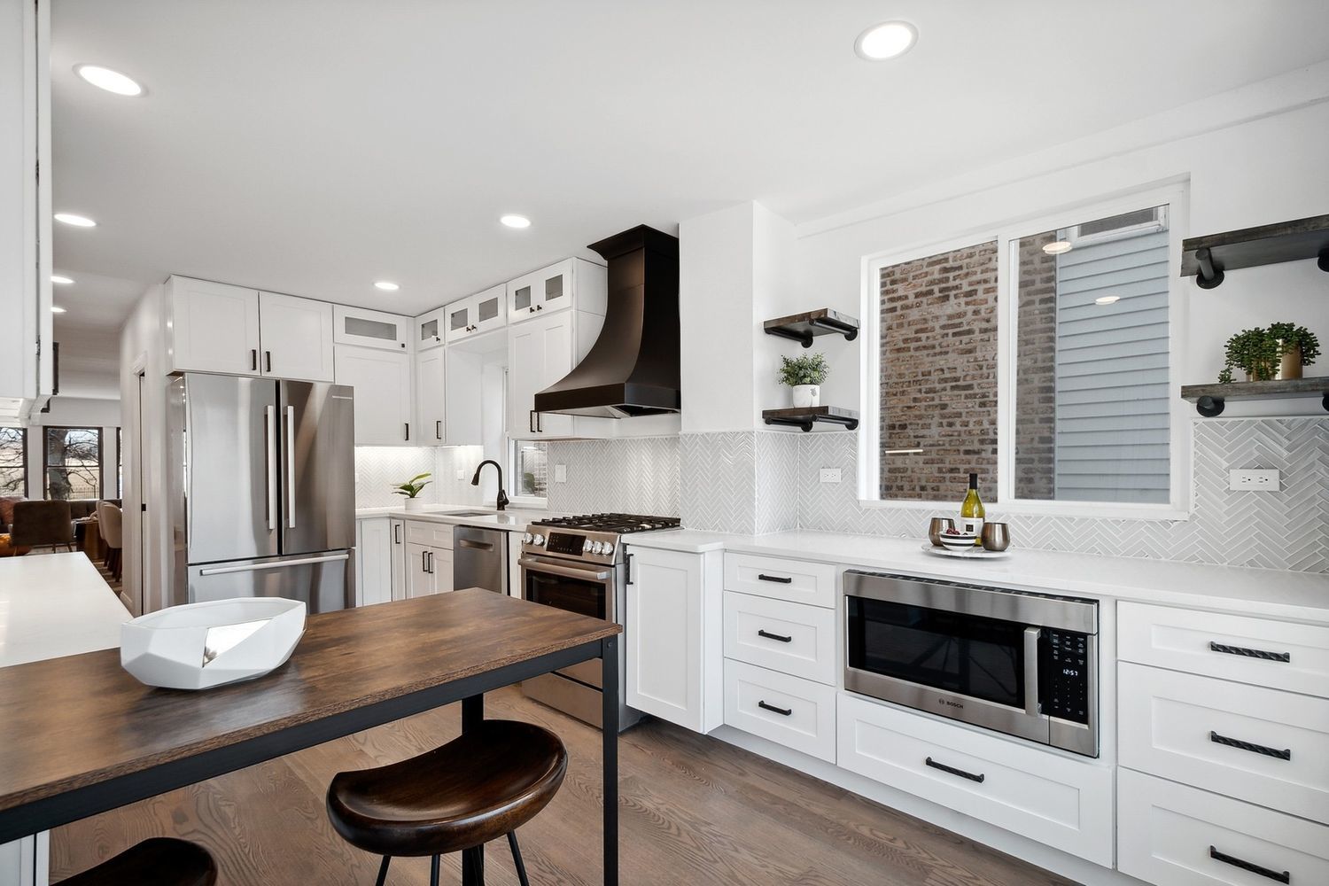 5426 North Western Avenue Chicago, IL 60625 - Photo 6 of 22 a kitchen with stainless steel appliances kitchen island granite countertop a stove a sink and a refrigerator