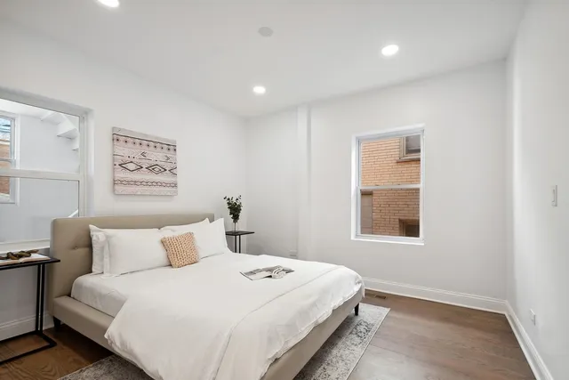 a bedroom with bed and a window