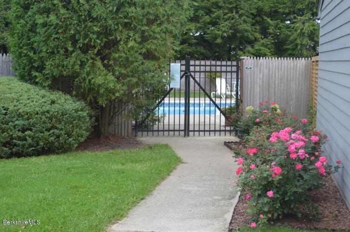 200 Old Stockbridge Road Lenox, MA 01240 - Photo 27 of 30 a view of garden with flowers and wooden fence