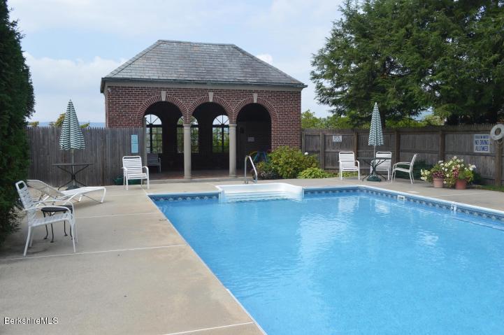 200 Old Stockbridge Road Lenox, MA 01240 - Photo 29 of 30 a view of a patio with table and chairs potted plants and large tree