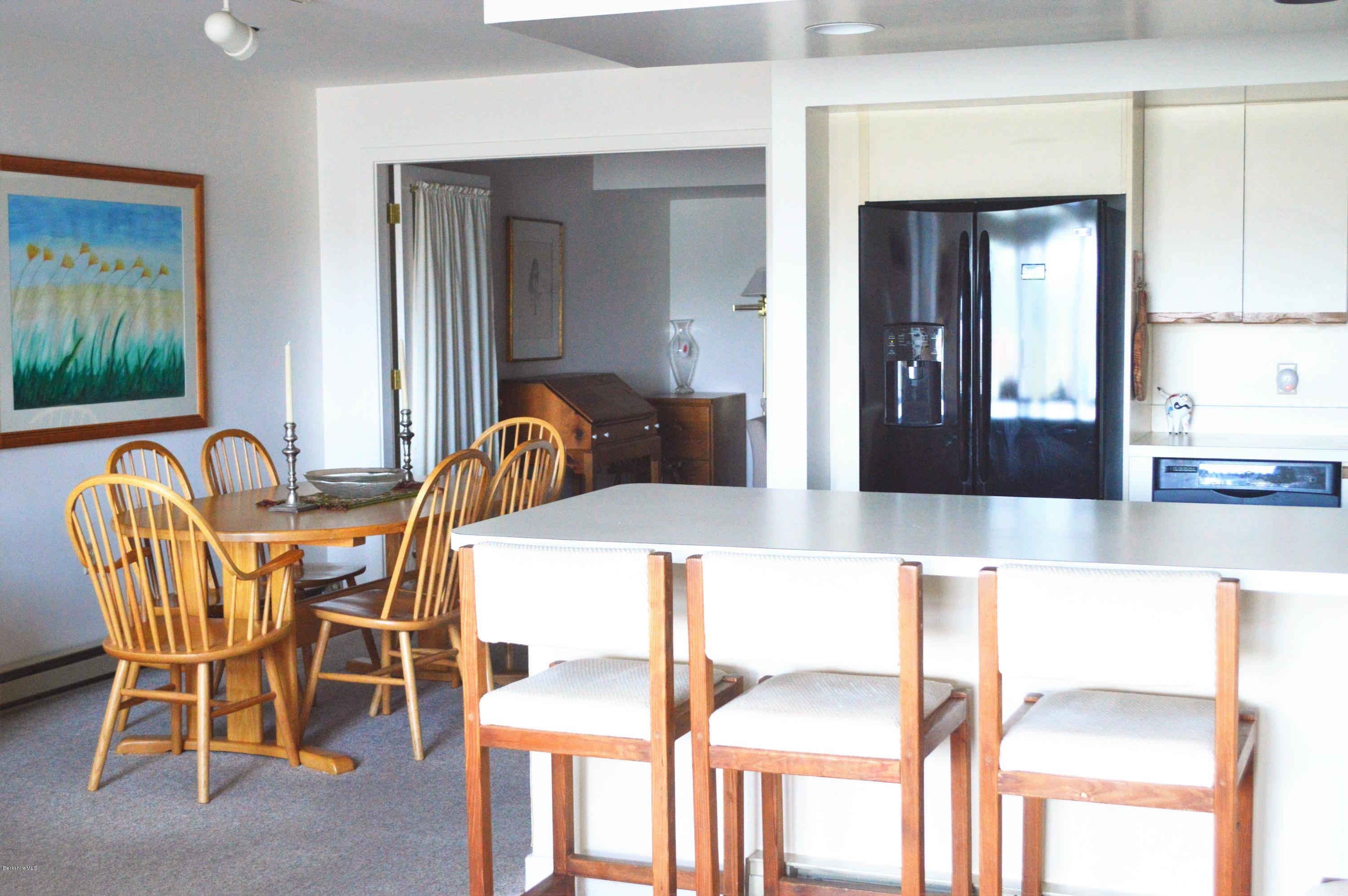 200 Old Stockbridge Road Lenox, MA 01240 - Photo 10 of 30 a view of a dining room with furniture and wooden floor