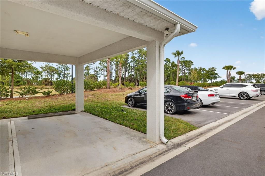 43985 Boardwalk Loop, Unit 2115 Punta Gorda, FL 33982 - Photo 21 of 28 a view of a car parked in front of a house