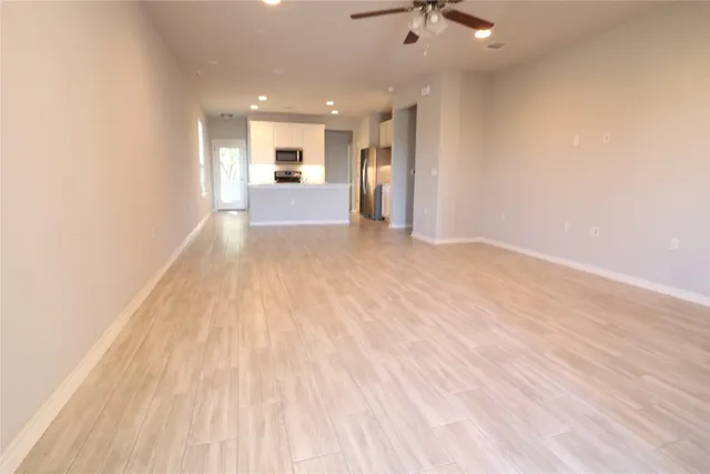 a view of a kitchen with a sink and a window