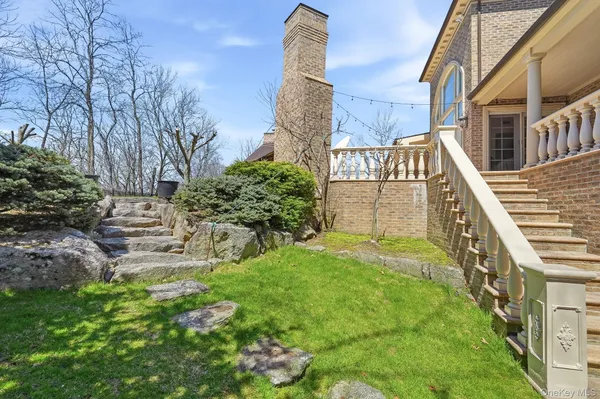 a backyard of a house with lots of green space