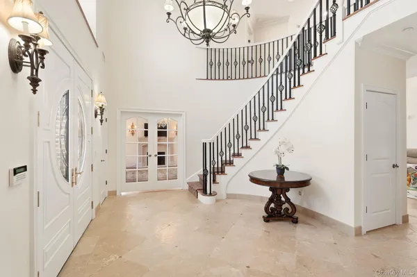 a view of an entryway with wooden floor