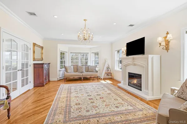 a living room with furniture fireplace and flat screen tv