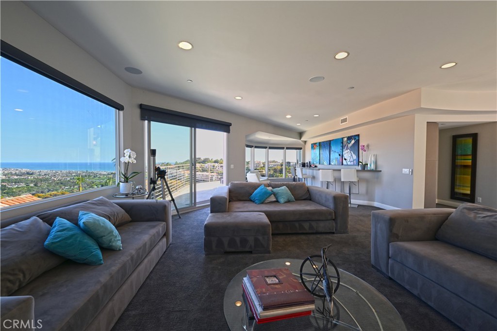 90 Marbella San Clemente, CA 92673 - Photo 12 of 39 a living room with furniture and a large window