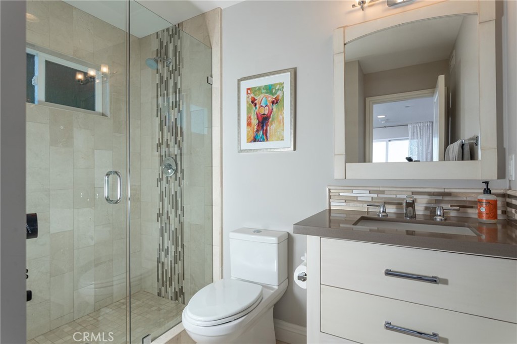 90 Marbella San Clemente, CA 92673 - Photo 20 of 39 a bathroom with a sink a toilet and shower