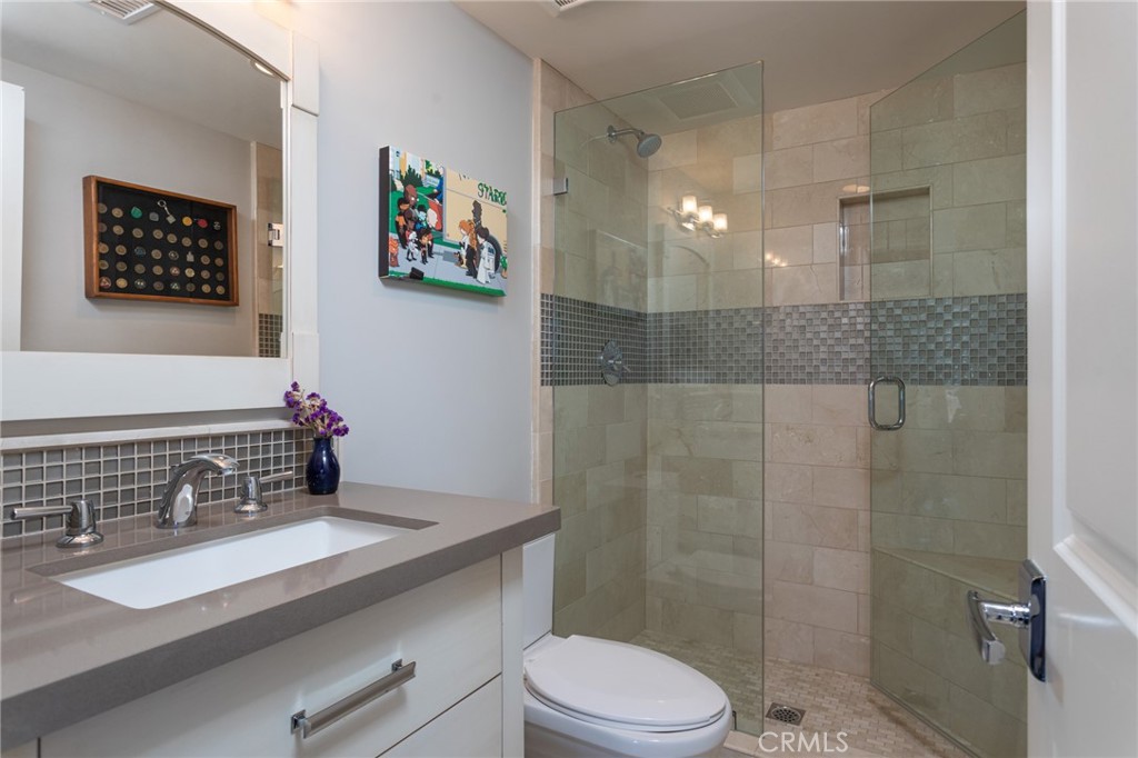 90 Marbella San Clemente, CA 92673 - Photo 22 of 39 a bathroom with a sink a toilet and shower