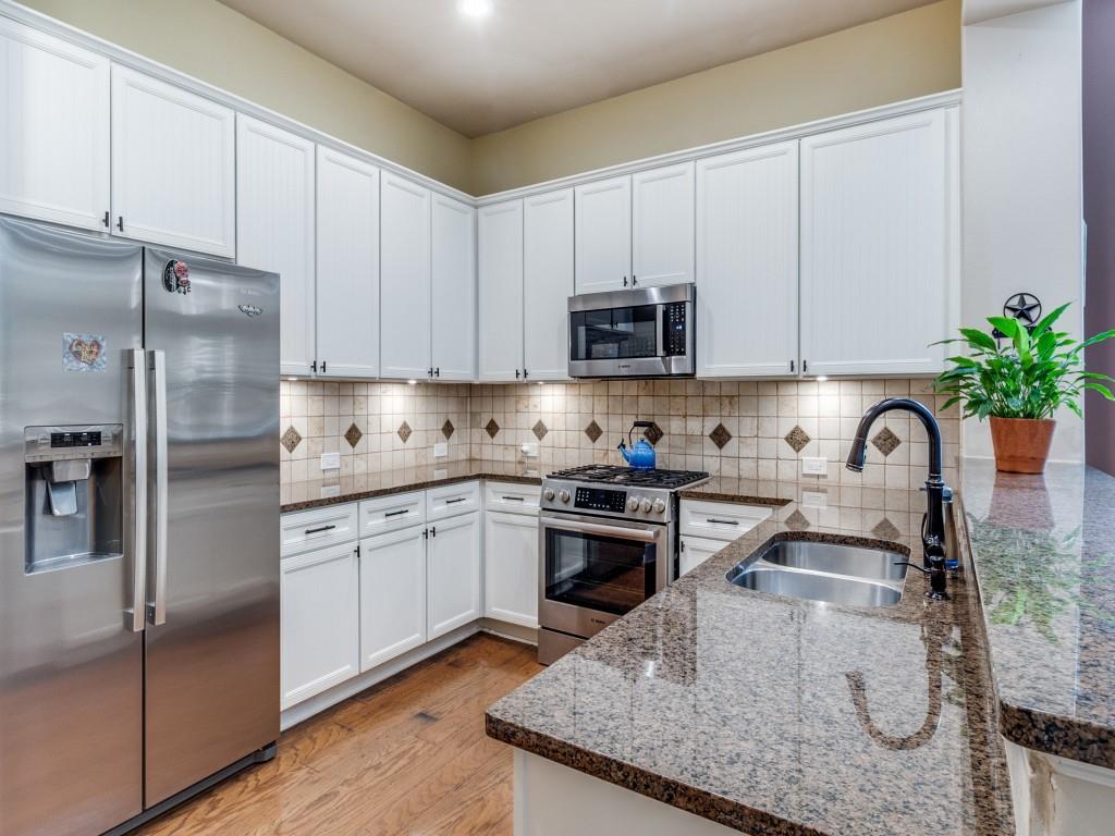 1600 Abrams Road, Unit 30 Dallas, TX 75214 - Photo 11 of 26 a kitchen with stainless steel appliances granite countertop a sink a stove and a refrigerator