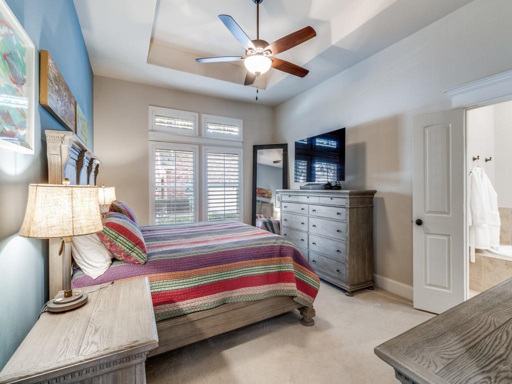 1600 Abrams Road, Unit 30 Dallas, TX 75214 - Photo 13 of 26 a spacious bedroom with a bed and a chandelier