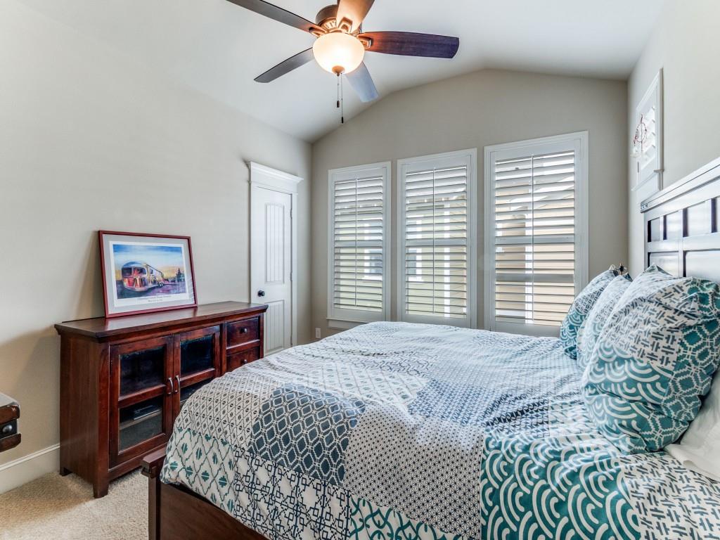 1600 Abrams Road, Unit 30 Dallas, TX 75214 - Photo 23 of 26 a bedroom with a bed and a chandelier