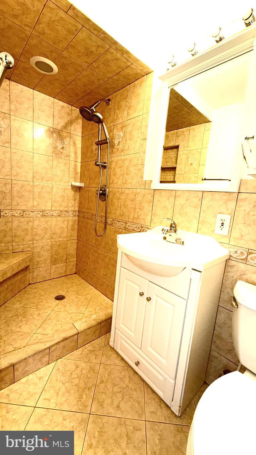 27 3rd Avenue Toms River, NJ 08757 - Photo 34 of 69 a bathroom with a tub sink and shower