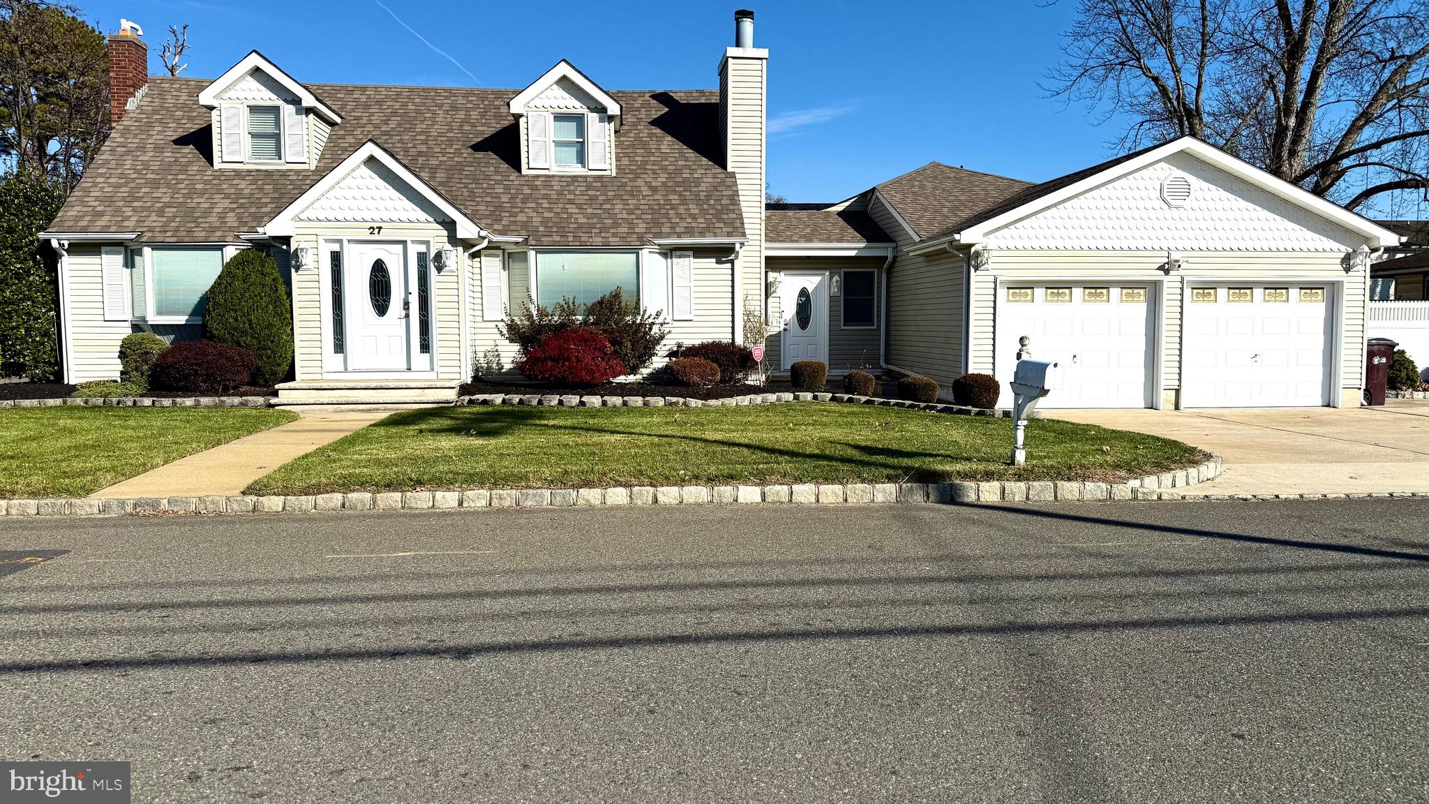 27 3rd Avenue Toms River, NJ 08757 - Photo 4 of 69 a front view of a house with a yard