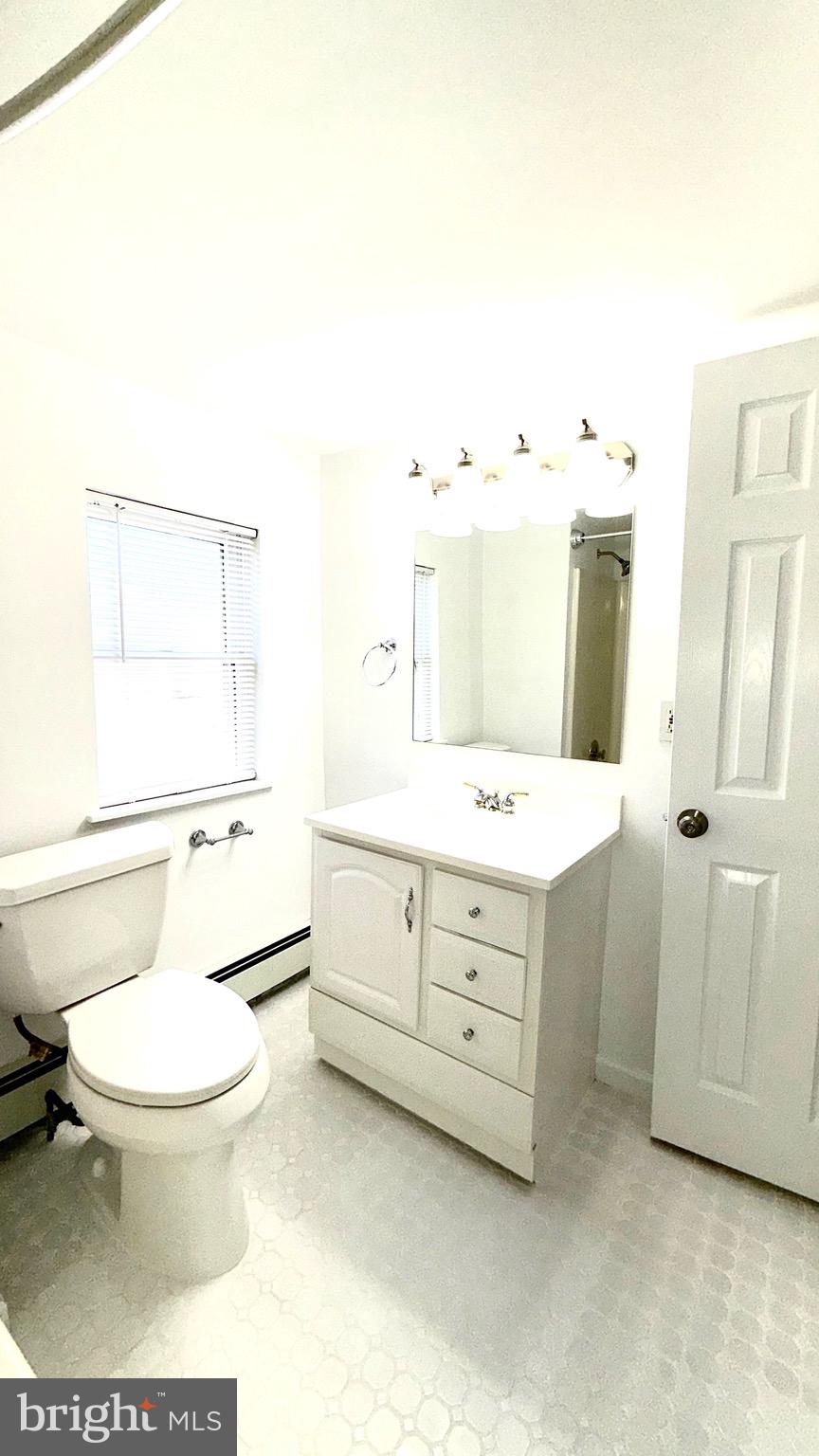27 3rd Avenue Toms River, NJ 08757 - Photo 42 of 69 a bathroom with a sink toilet and shower