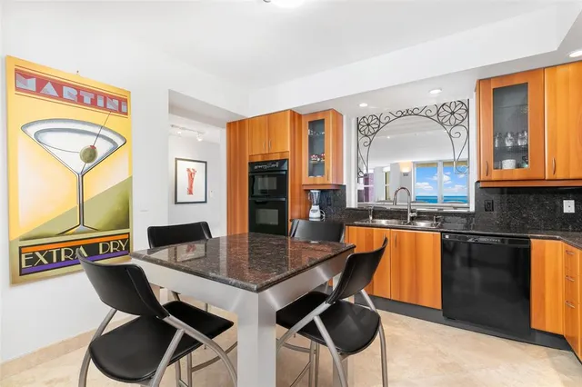 a view of a dining room that has a table and chairs in it
