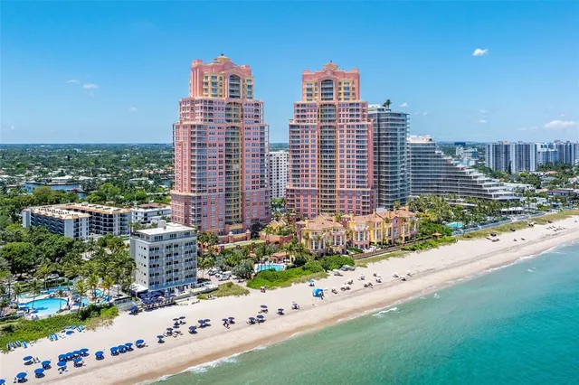 a bathroom with a bathtub a double vanity sink and a shower