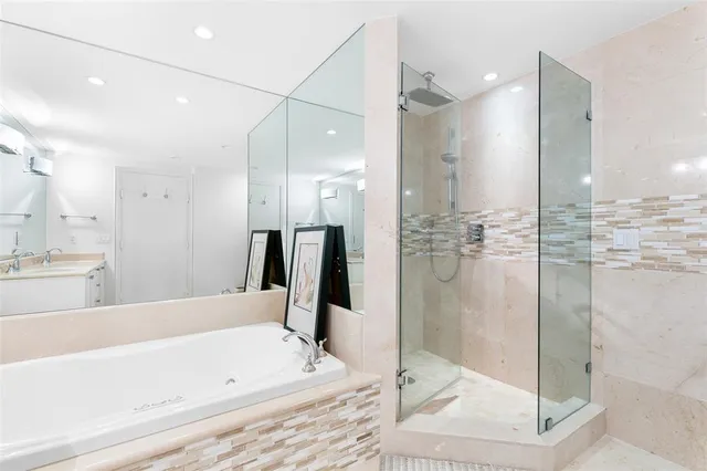 a bedroom with a bed and flat screen tv