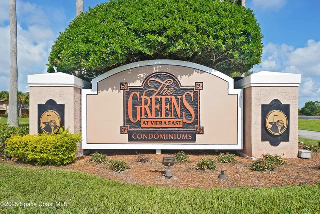 a view of a sign board with a small yard