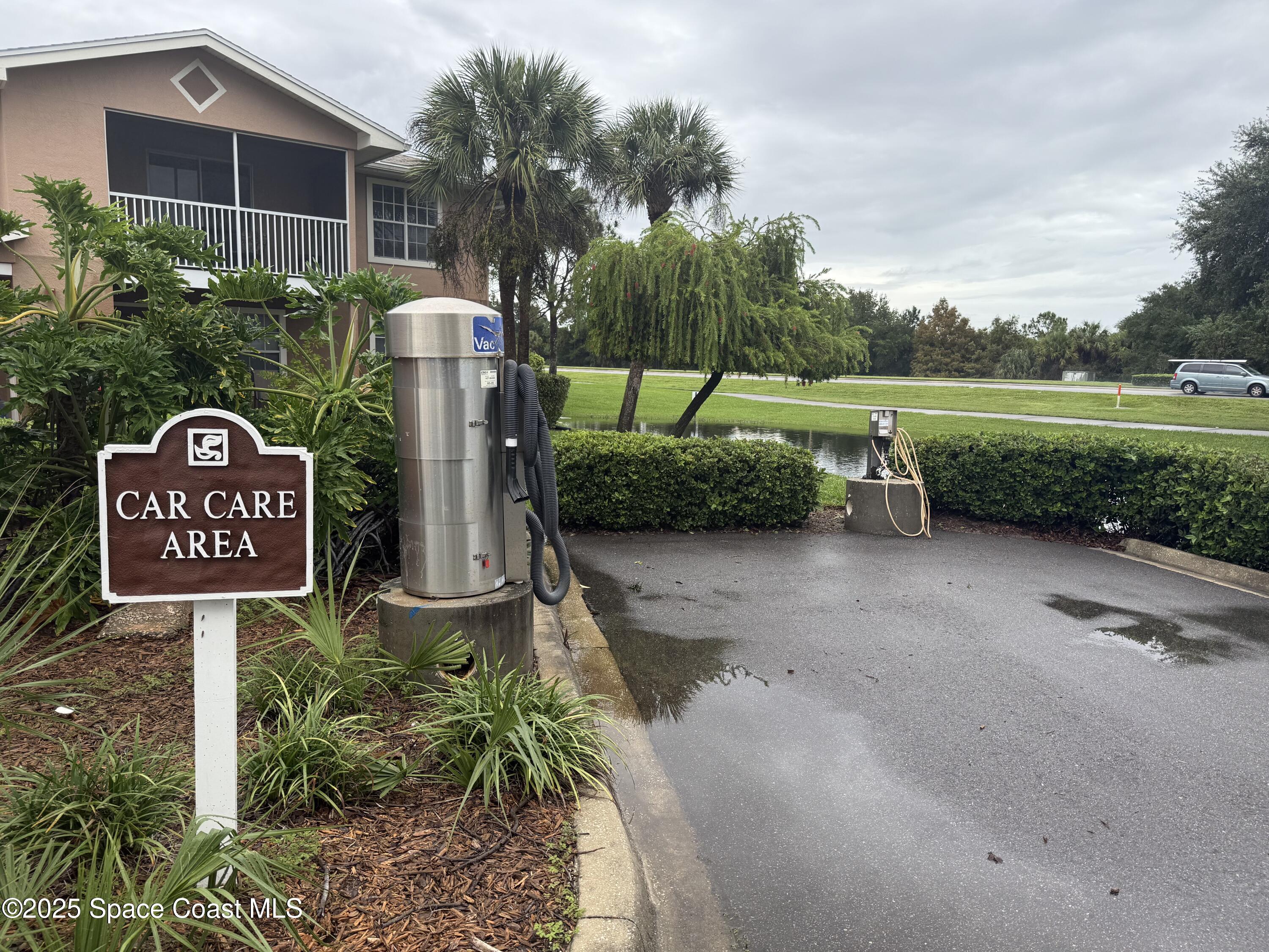 1790 Rocky Wood Circle, Unit 205 Rockledge, FL 32955 - Photo 6 of 11 a view of a street with potted plants and a houses