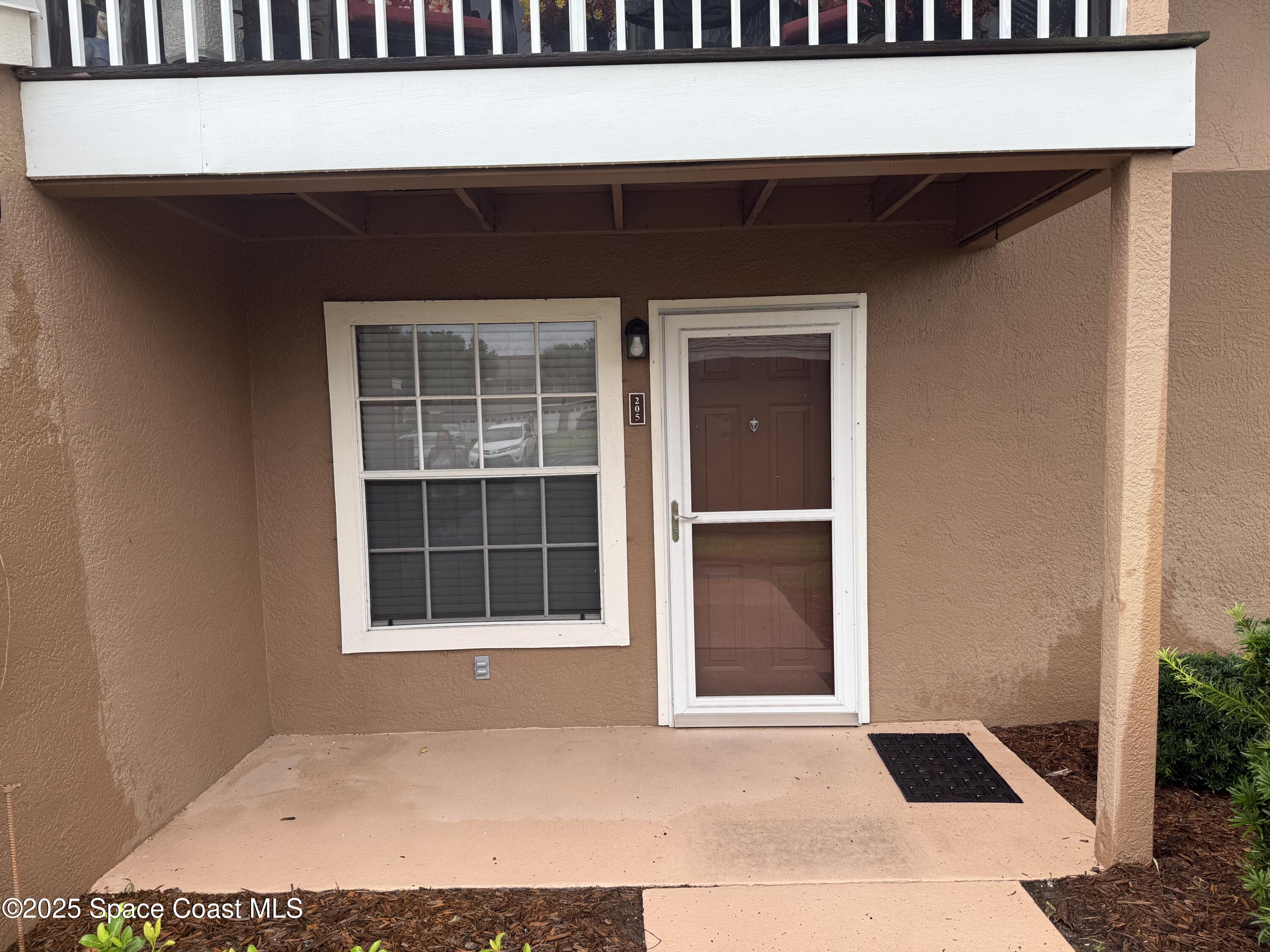 1790 Rocky Wood Circle, Unit 205 Rockledge, FL 32955 - Photo 7 of 11 a view of an entryway