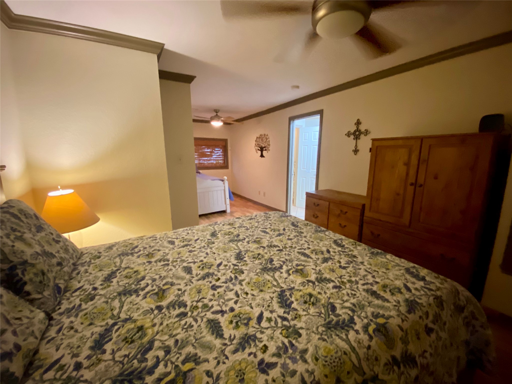 173 Ridgecrest Drive Burkeville, TX 75932 - Photo 18 of 27 a bedroom with a bed and wooden floor