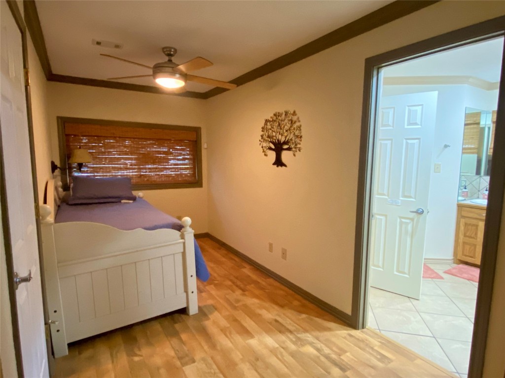 173 Ridgecrest Drive Burkeville, TX 75932 - Photo 20 of 27 a room with a bed and a dresser