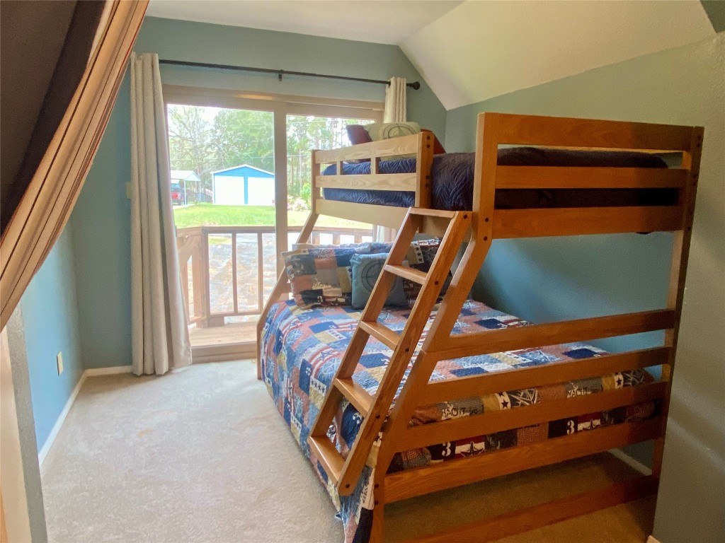 173 Ridgecrest Drive Burkeville, TX 75932 - Photo 24 of 27 a bedroom with bunk bed and a window