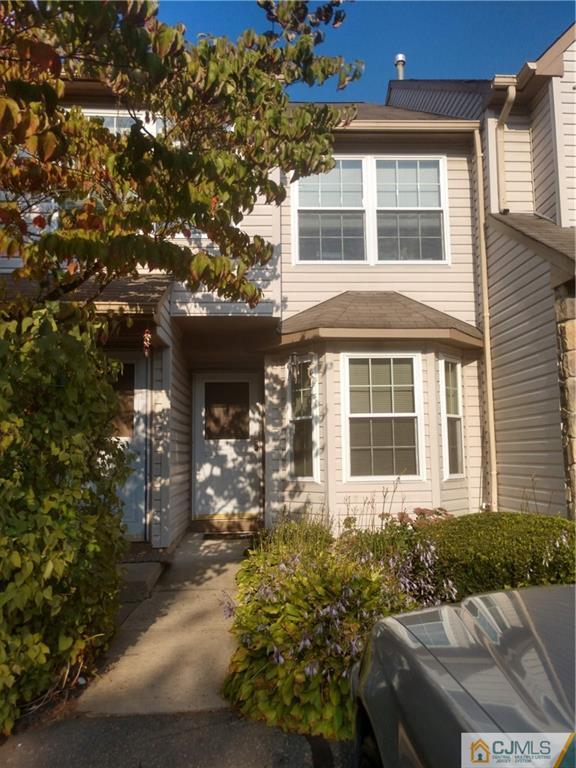 234 Nebula Road, Unit 234 Piscataway, NJ 08854 - Photo 2 of 4 a front view of a house with a yard